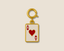 Gold Ace of Hearts card charm on a beige background