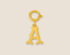Gold charm with letter 'A' on a beige background