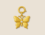 Gold butterfly charm with a diamond on a beige background