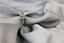 Top shot of 18K yellow gold solitaire ring with single emerald cut diamond