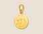 Gold charm pendant with a guruji engraved on a beige background