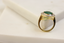 Side shot of emerald and Natural cocktail ring with vintage feel 