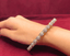 Luxurious diamond bangle with intricate gold and diamond design on hand