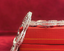 Close up shot of 18K white gold diamond bangle with double-row diamond brilliance