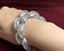 18K white gold diamond bangle with double-row diamond brilliance on hand