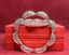 Product shot of 18K white gold diamond bangle with double-row diamond brilliance