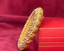 Side view shot of handcrafted 22k Gold Kadda (bangle) with intricate gold designs
