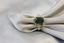 Product shot of diamond and emerald ring in 18K gold - perfect modern design
